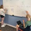 two students studying in collaboration room